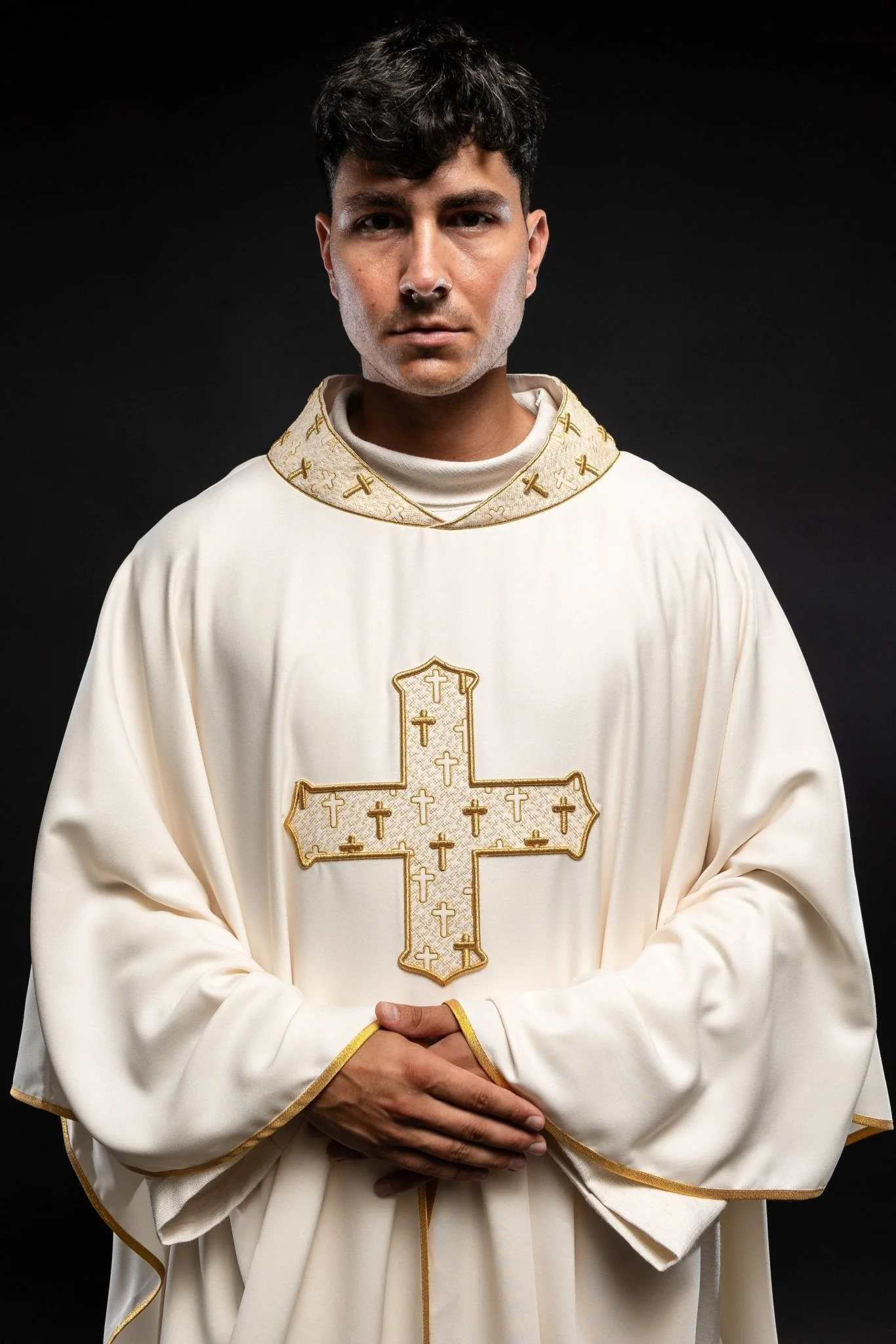 Chasuble made of ecru texture with gold cross embroidery on collar