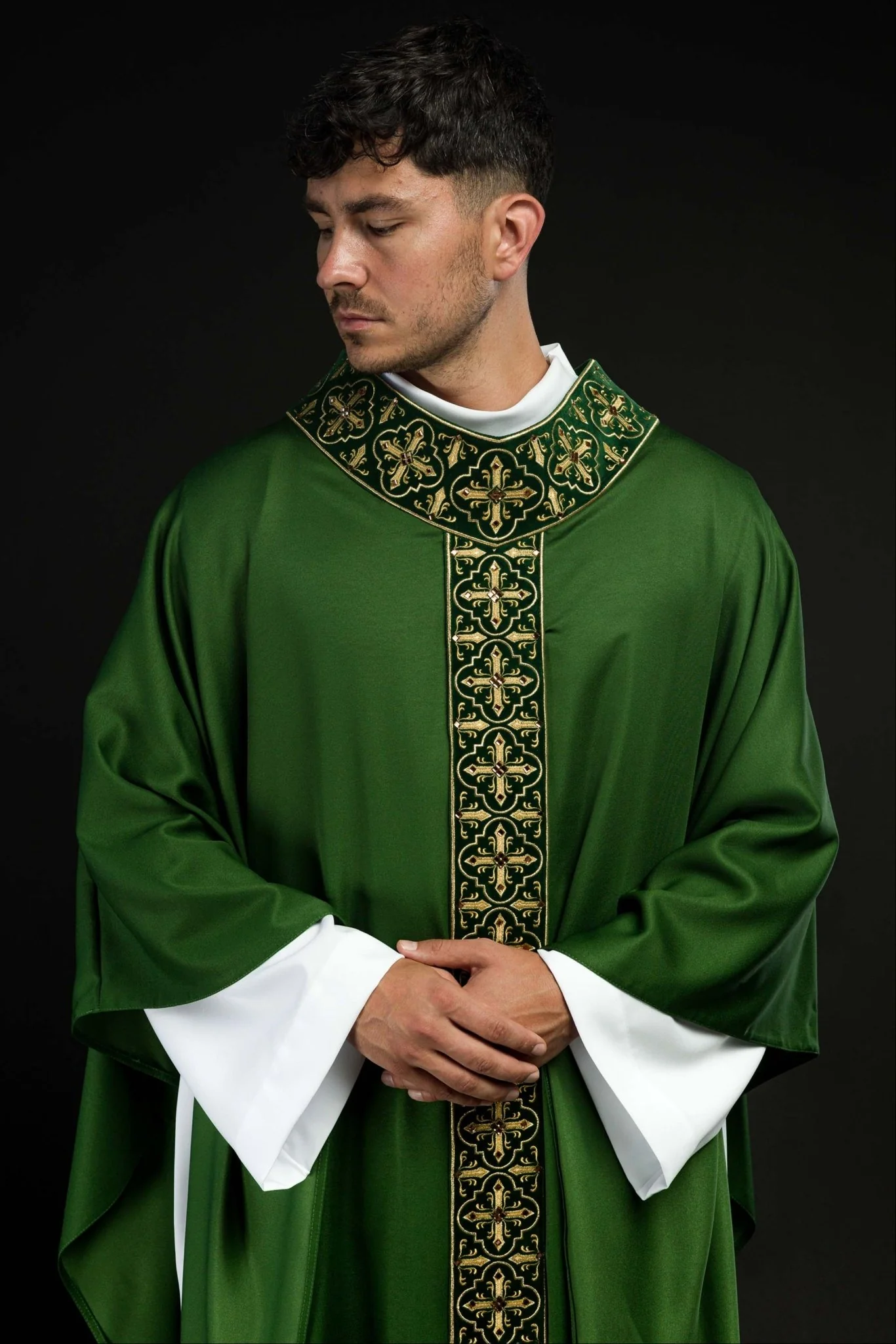 Green chasuble adorned with stones and a narrow band