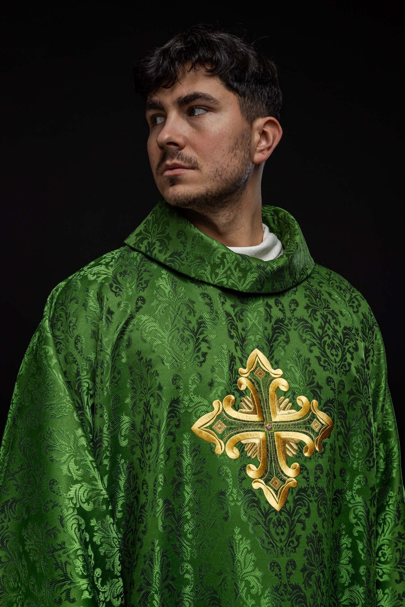 Green chasuble with cross sewn from patterned fabric
