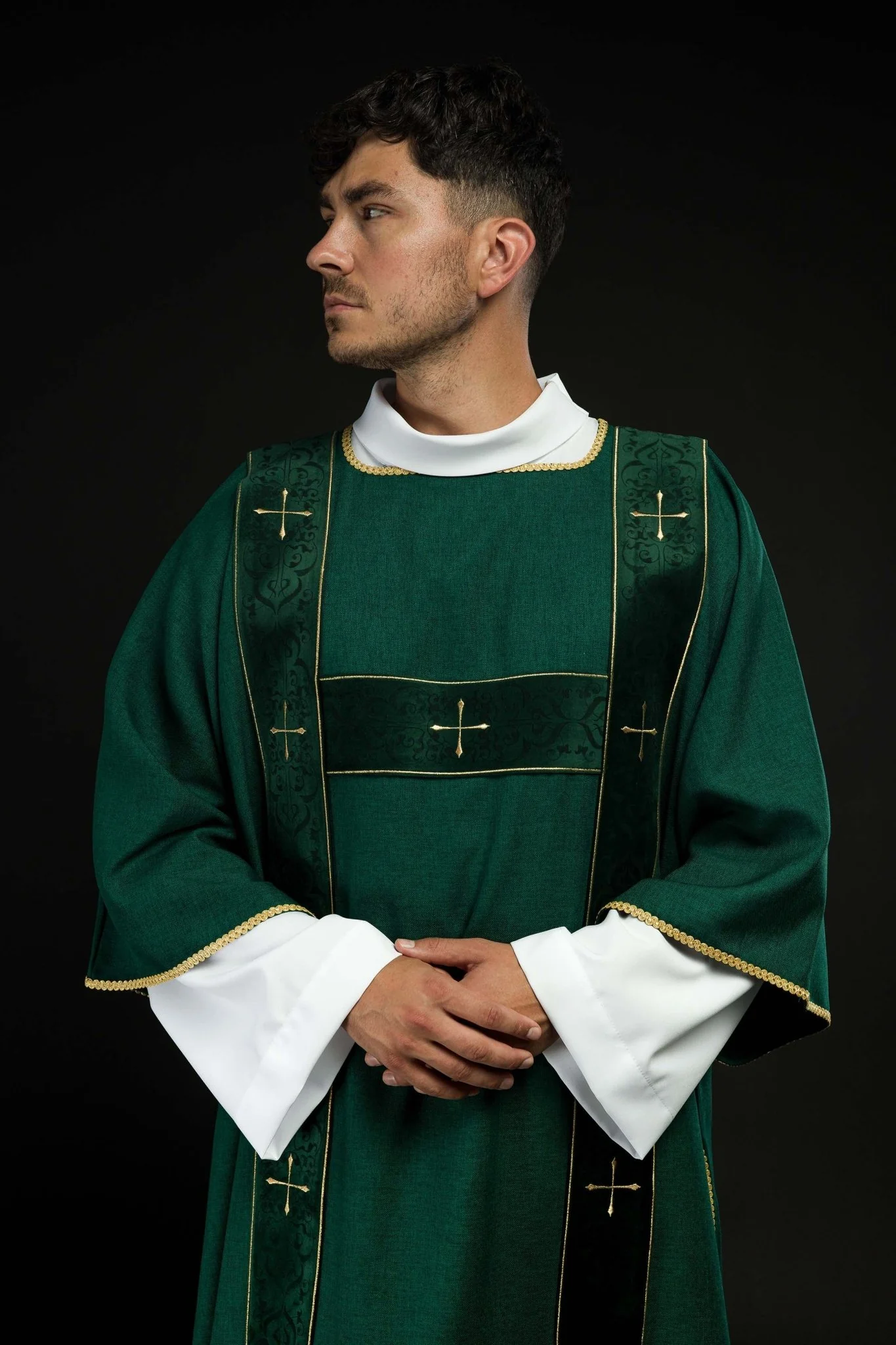 Green dalmatic with velvet bands and embroidered golden crosses