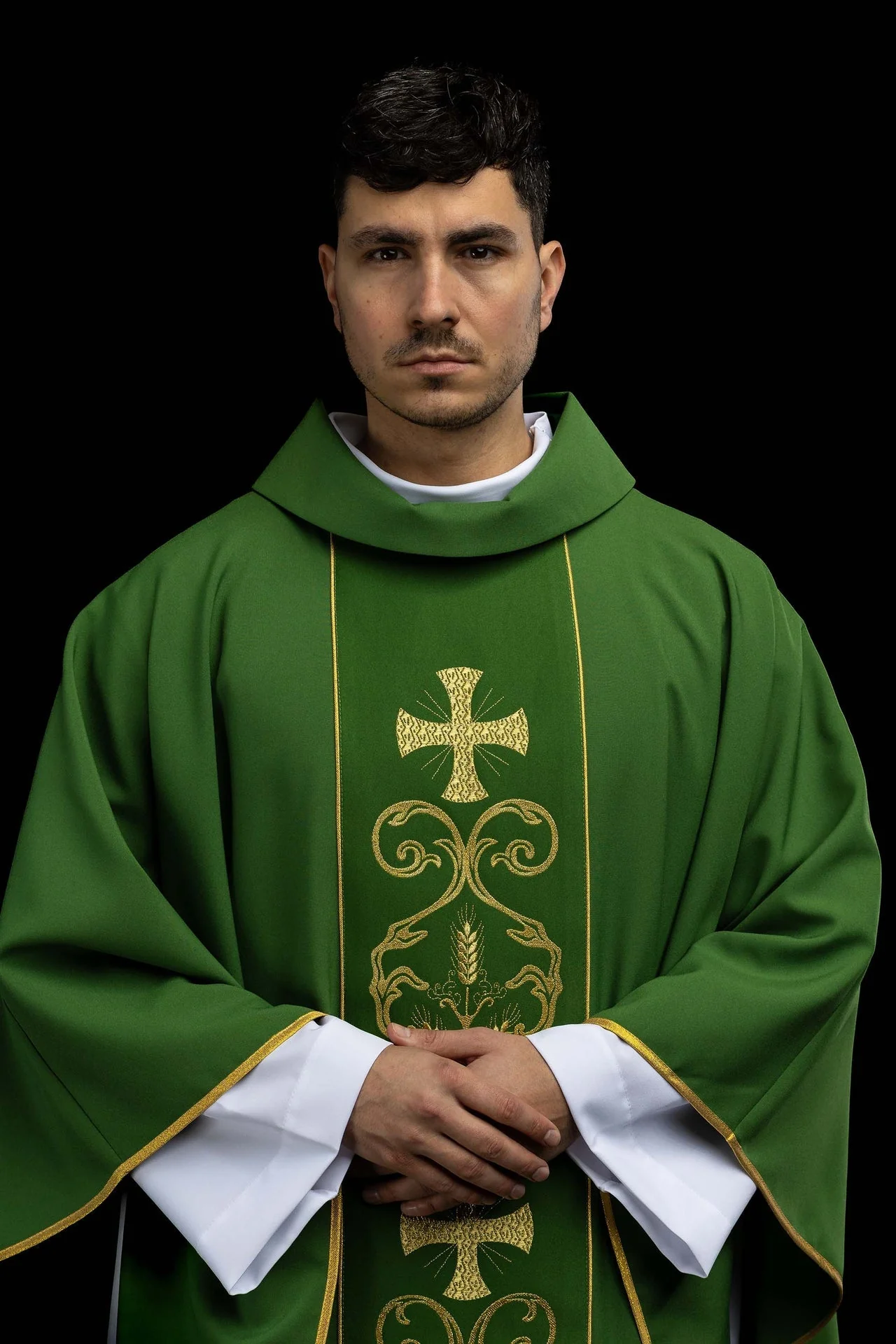 Green liturgical chasuble decorated with an embroidered central panel