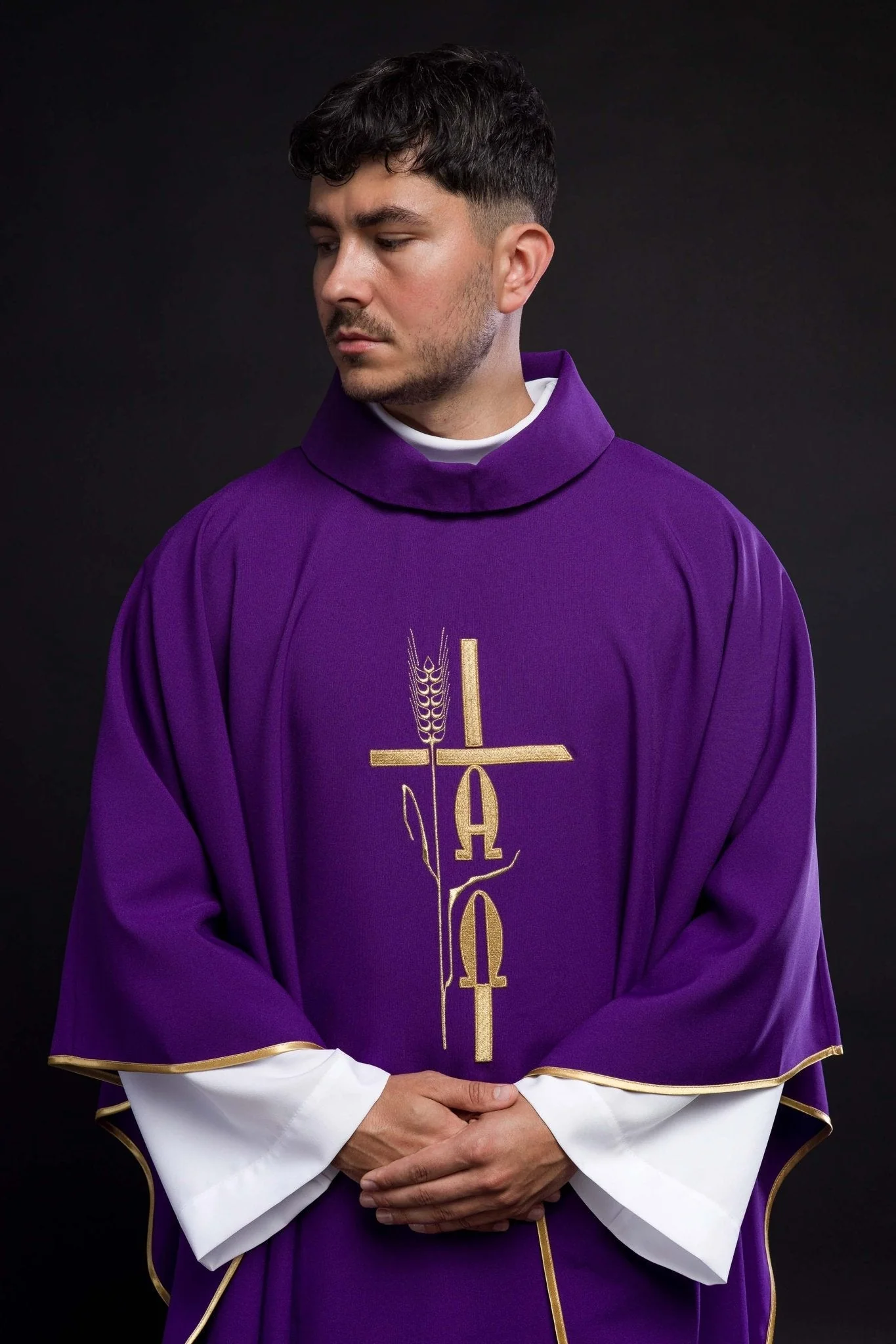 Purple chasuble with cross and alfa omega symbols