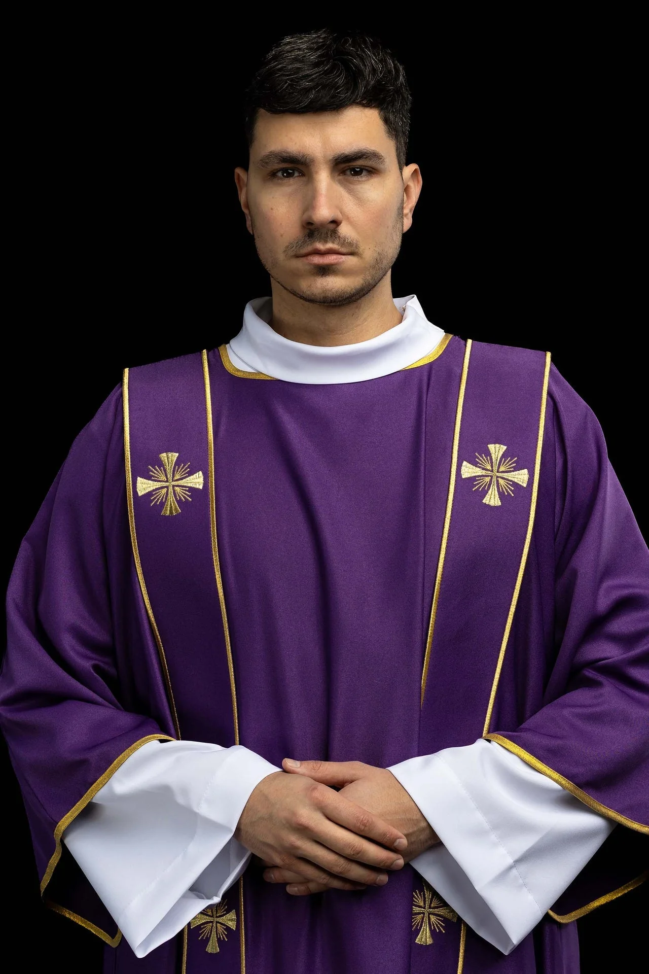 Purple dalmatic with bands and embroidered gold crosses