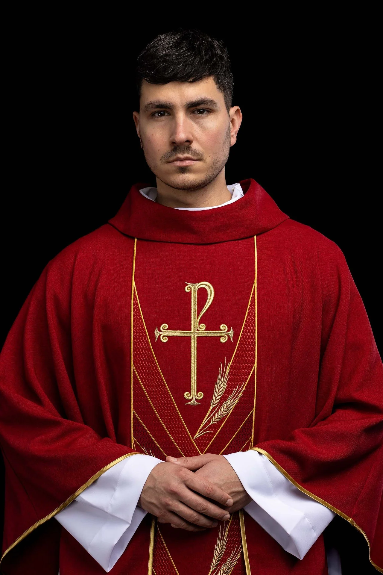 Red chasuble with an embroidered Pax band