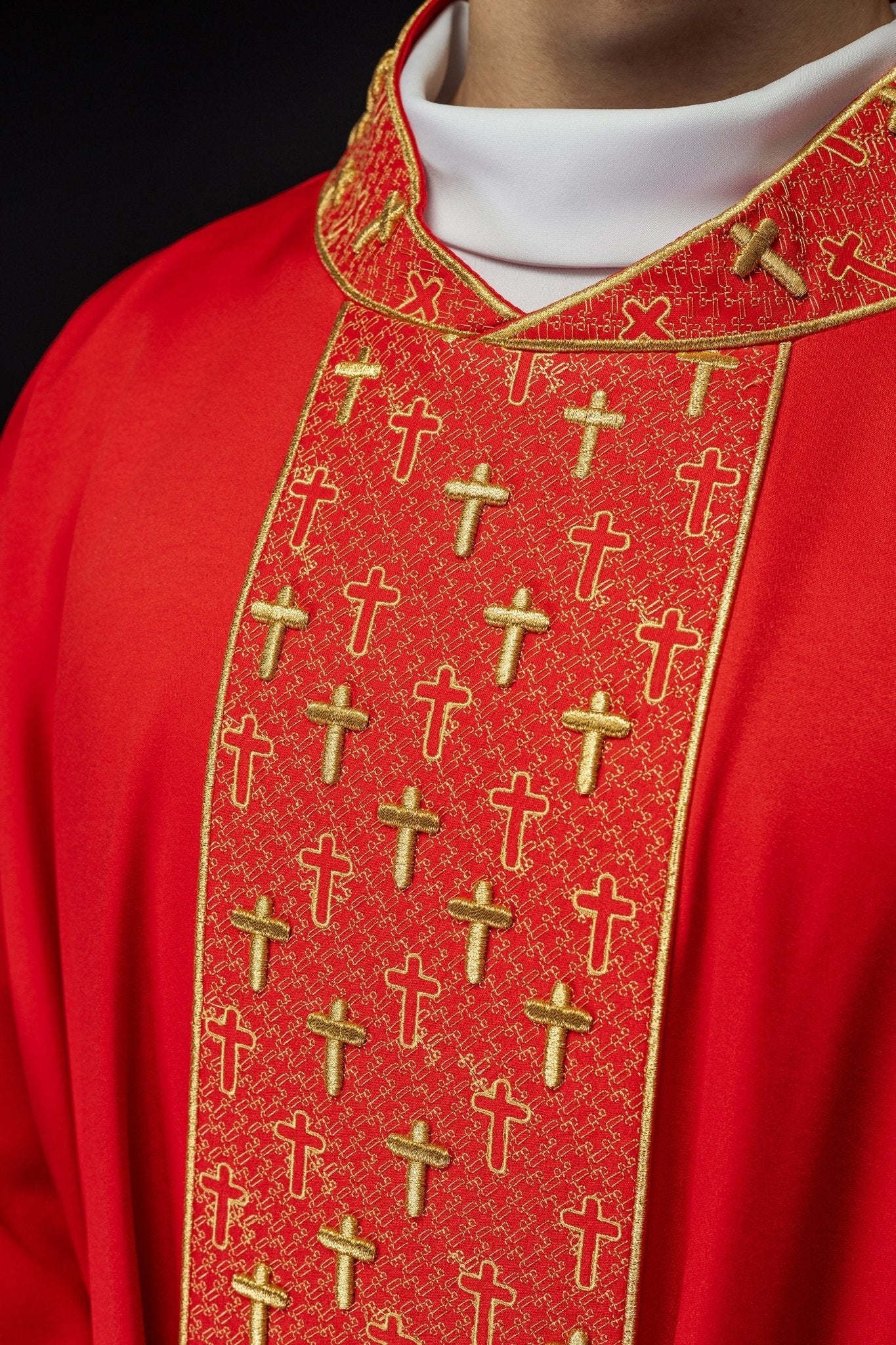 Red chasuble with gold cross embroidery on wide orphrey and collar