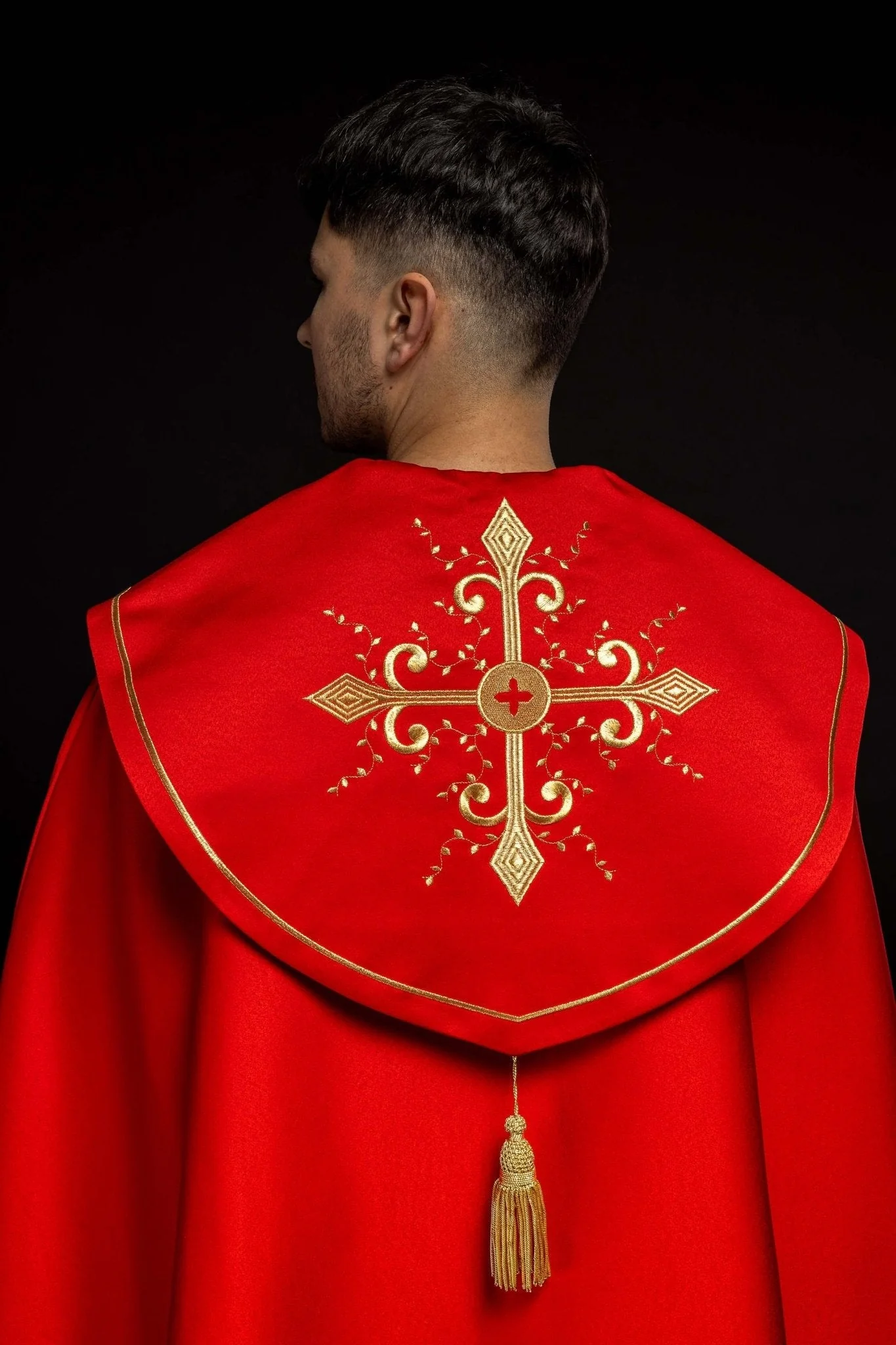 Red church cope with embroidery with gold crosses