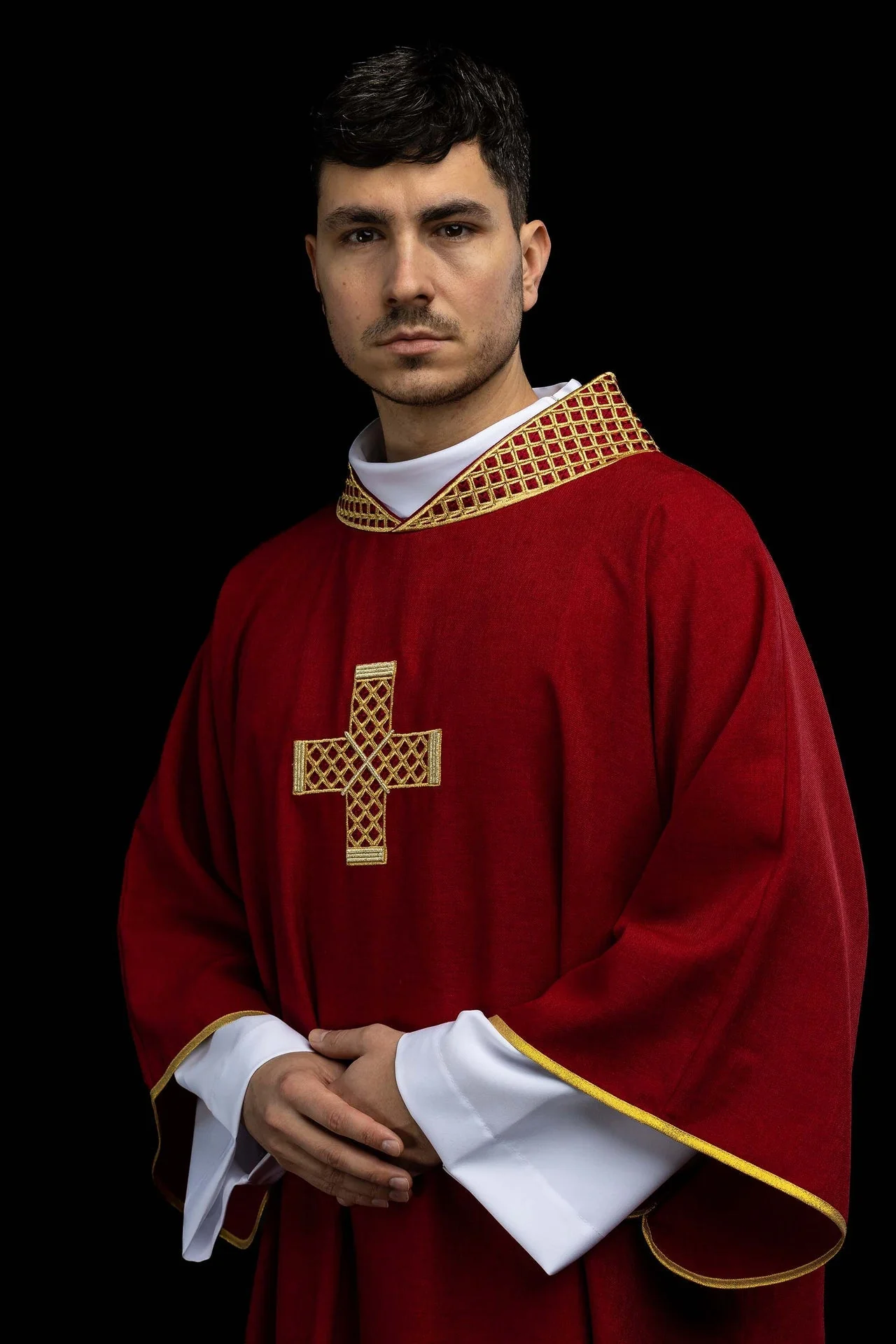 Red dalmatic with embroidered crosses and a collar