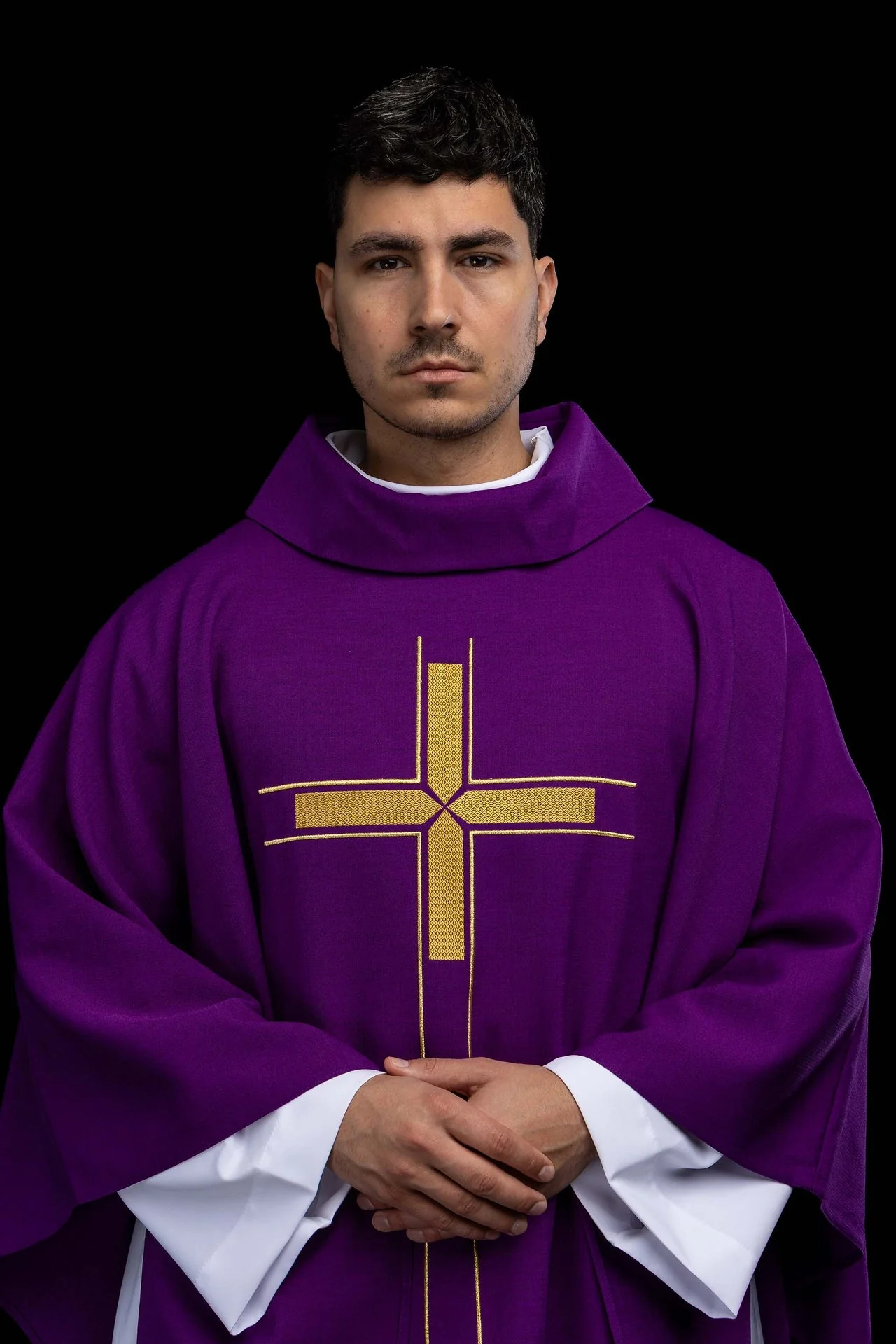 Violet liturgical chasuble with an embroidered cross motif